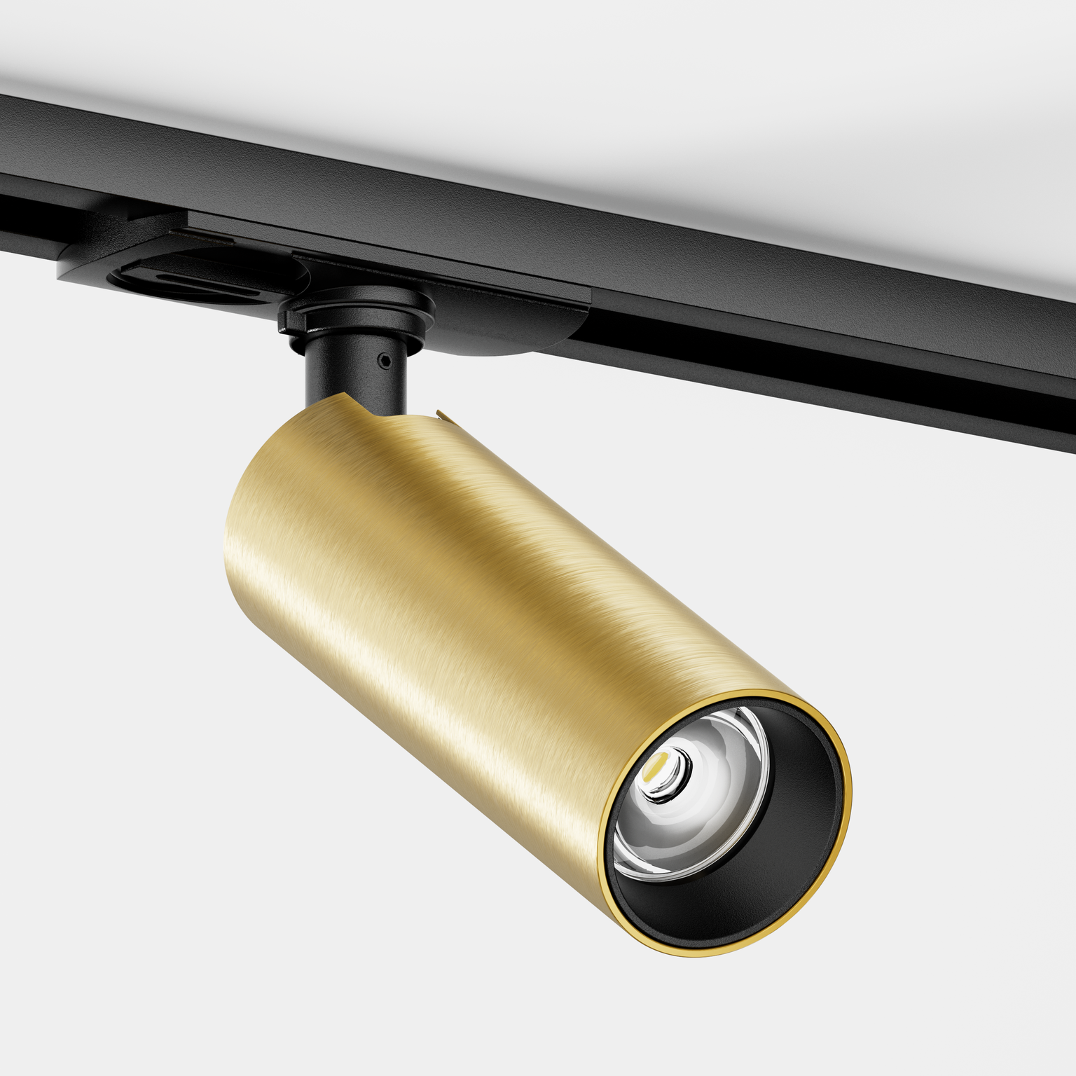 Tuup Slim 1-fase railspot in een zwarte rail, met tube in geborsteld messing